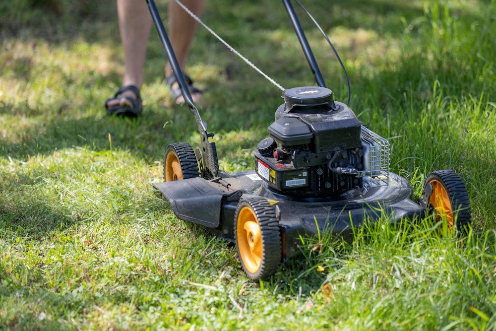 Lawn mower cutting grass